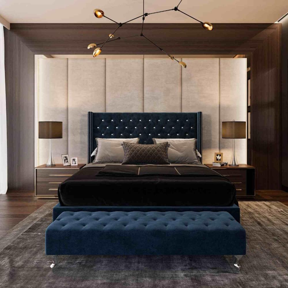 Luxurious bedroom with a blue tufted Cheap bed Frame, matching bench, modern chandelier, and dark wood furniture.