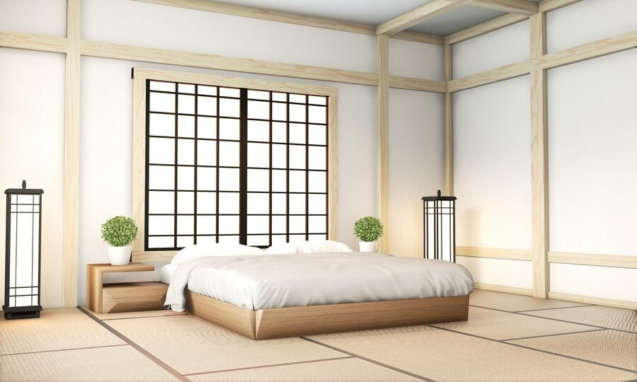 Bedroom with a single floor bed, shoji screen, and tatami flooring.