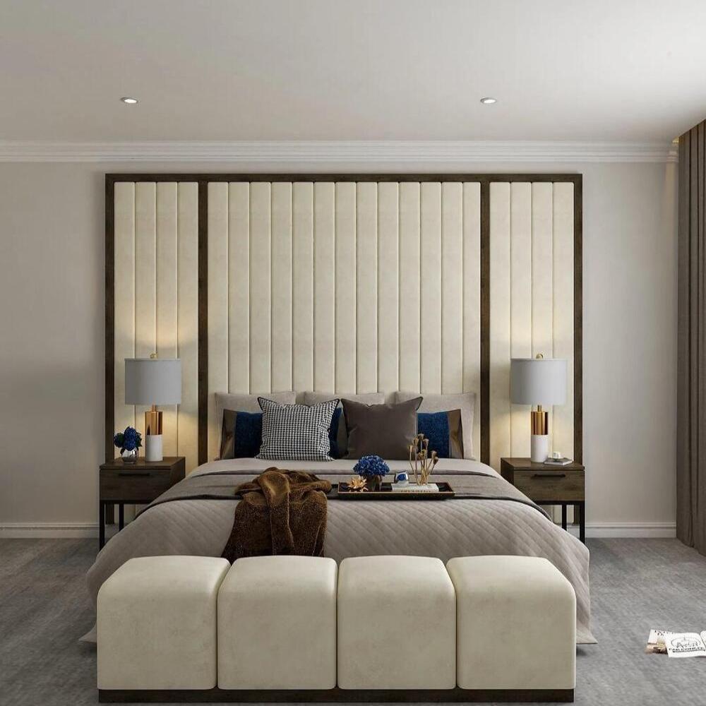 Modern bedroom with a large bed, beige headboard, and white ottoman bed at the foot.