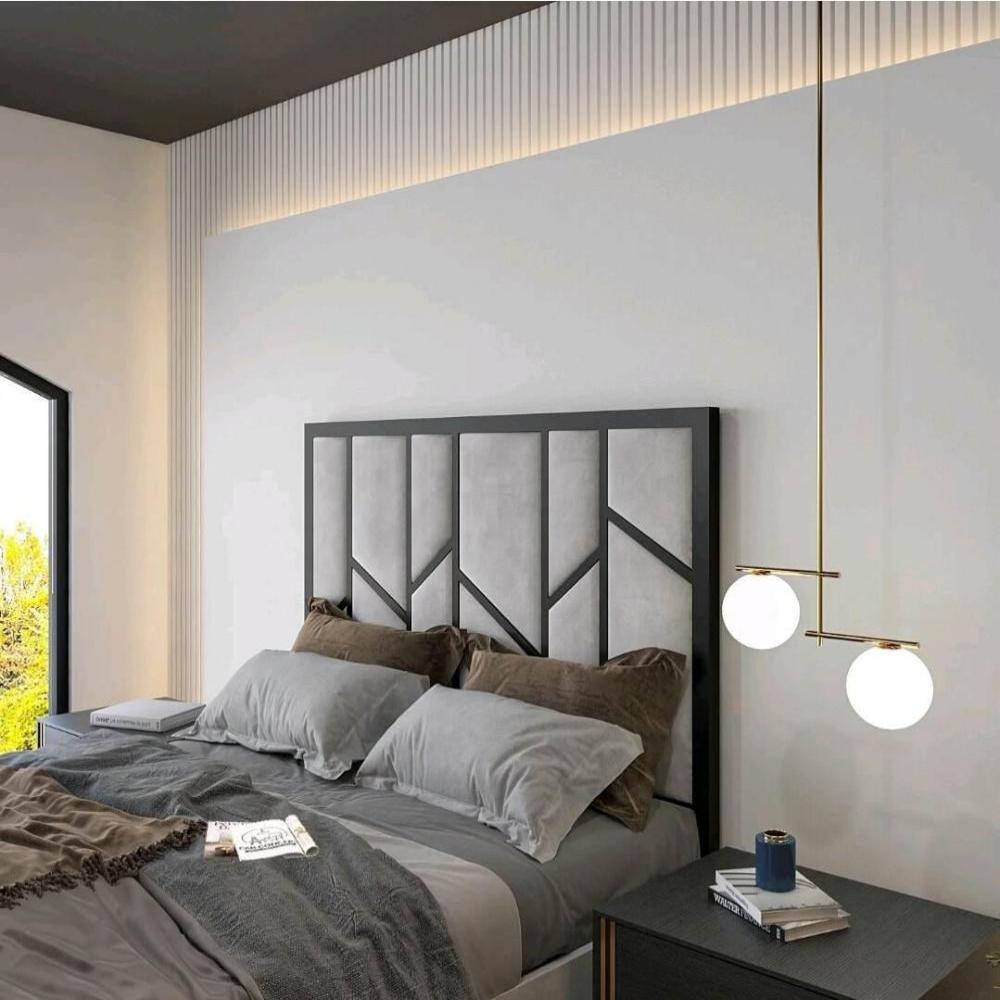 Modern bedroom with geometric headboards double on a bed, pendant light, and nightstand.