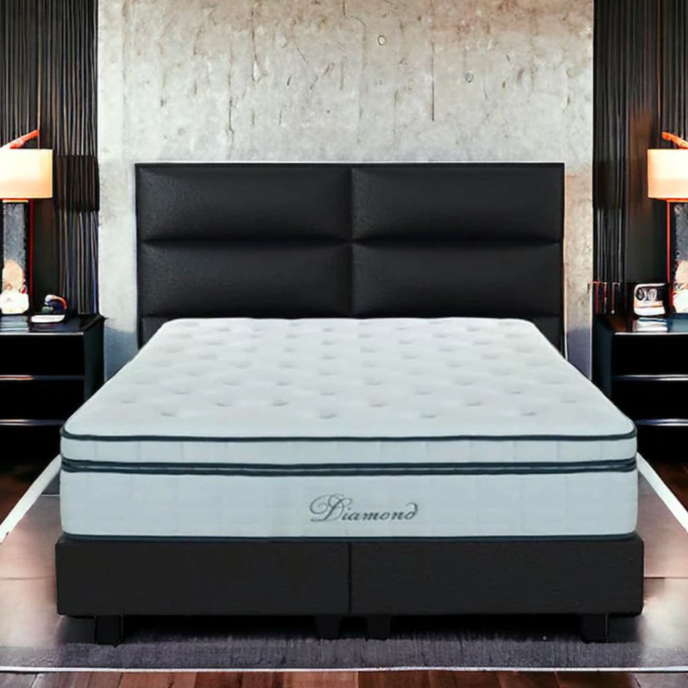 A bed with a "Diamond 1000" mattress in a stylish bedroom.