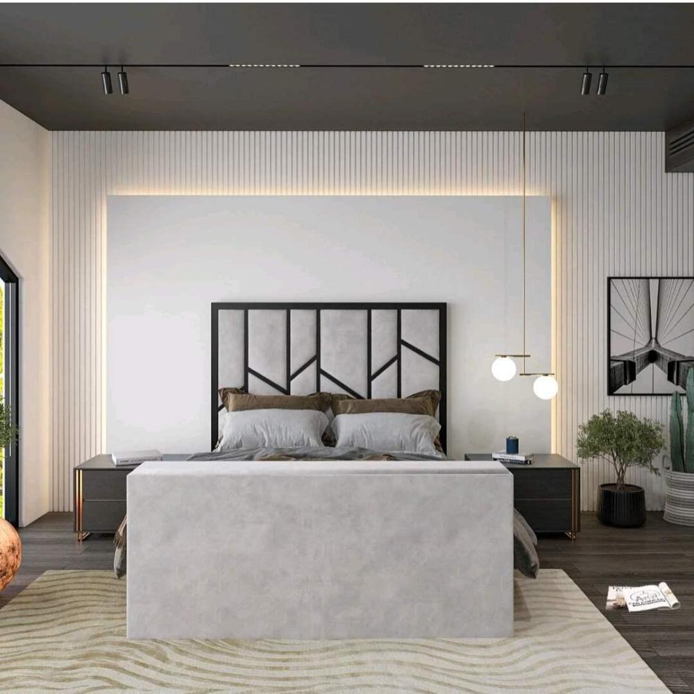 Modern bedroom with a gray Zig Zag Tv bed, geometric headboard, pendant lights, dark wood floor, and abstract art.

